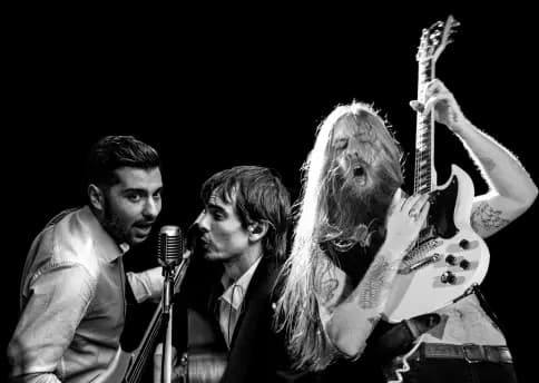 Professional 3-piece rock band in black and white, featuring an intense lead singer, acoustic guitarist and electric guitar player.
