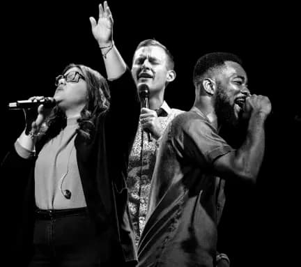 Professional vocal trio performing soul and gospel music in black and white.